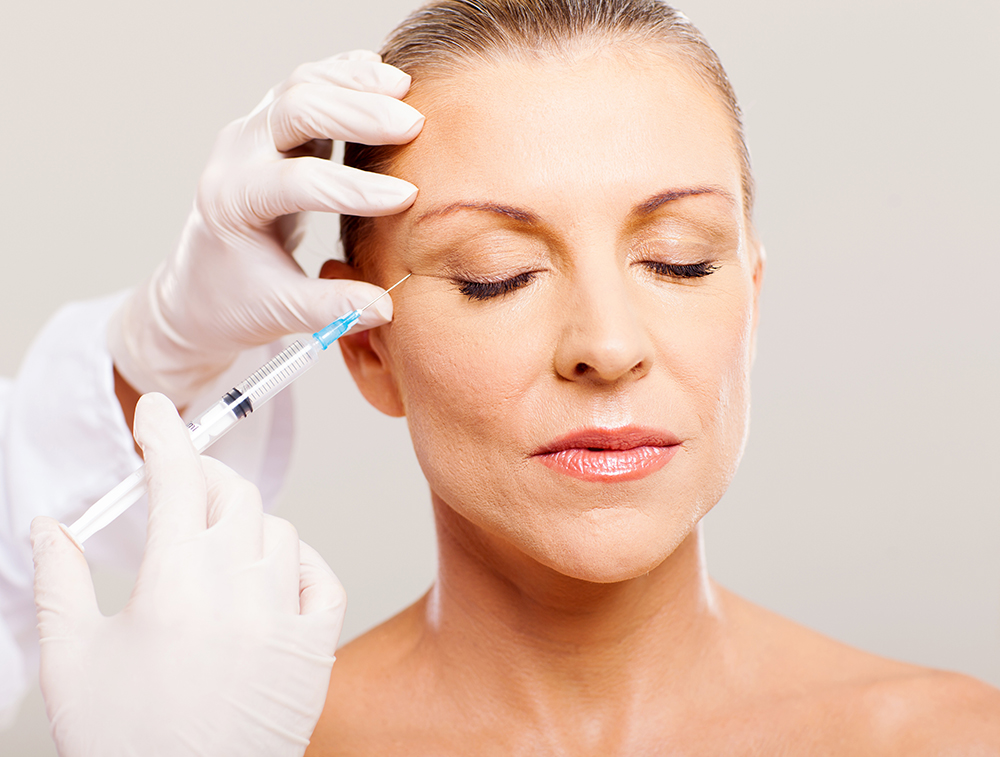 beautician giving face lifting injection beautician giving face lifting injection